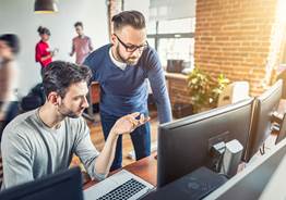 Two men on computer